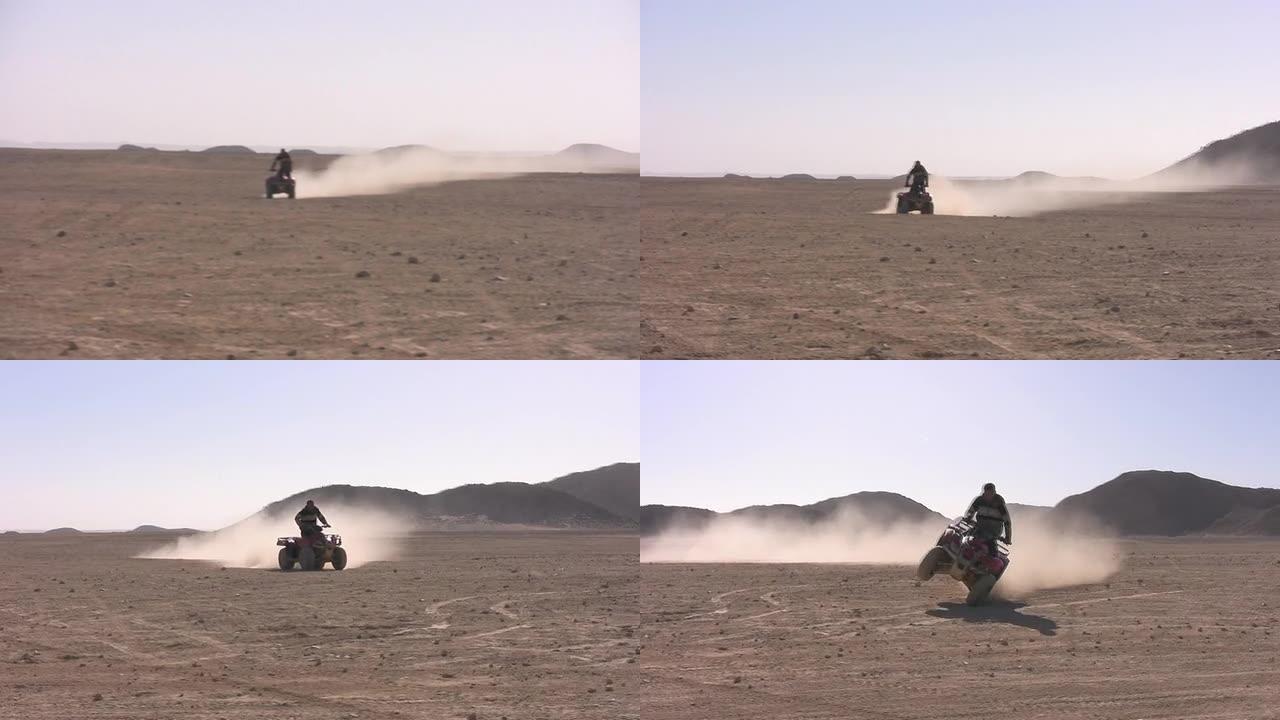 骑四轮自行车沙漠骑手沙漠驾驶沙地运动