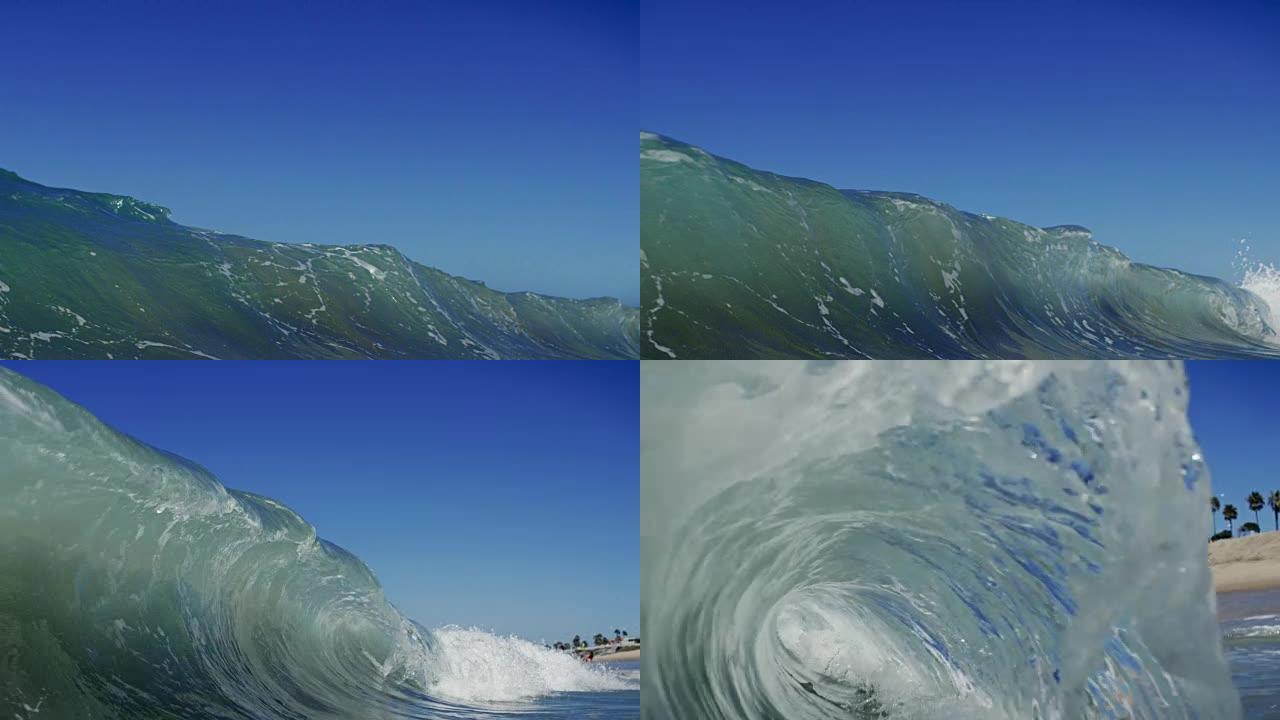 在加利福尼亚夏日的阳光下，一个完美美丽的波浪在POV的相机上突破。在4k中以150FPS的速度在红龙