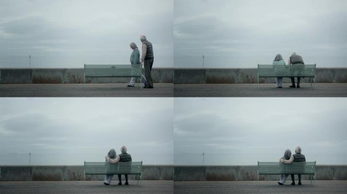坐在海边的老夫妇海边的老夫妇老人