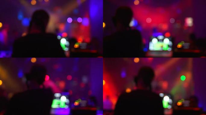 迪斯科舞厅后视图中的DJ（散焦）