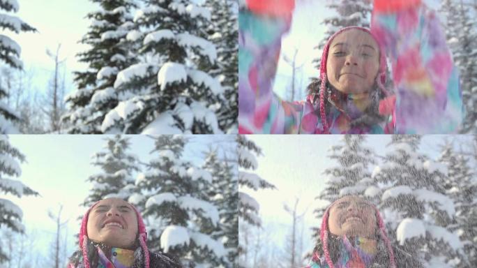 年轻女孩向空中扔雪