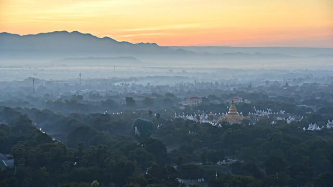 日出在缅甸曼德勒山的群山后面，时间流逝。