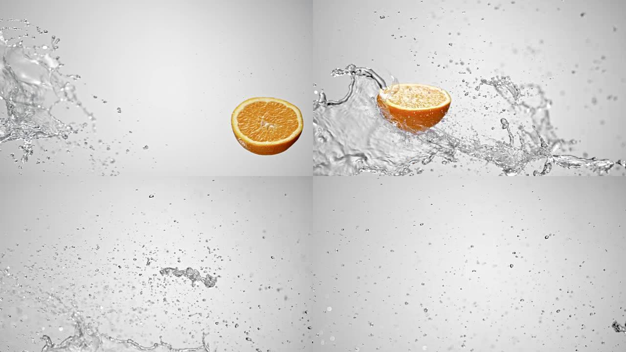 SLO MO一半的橙色被水溅到空气中