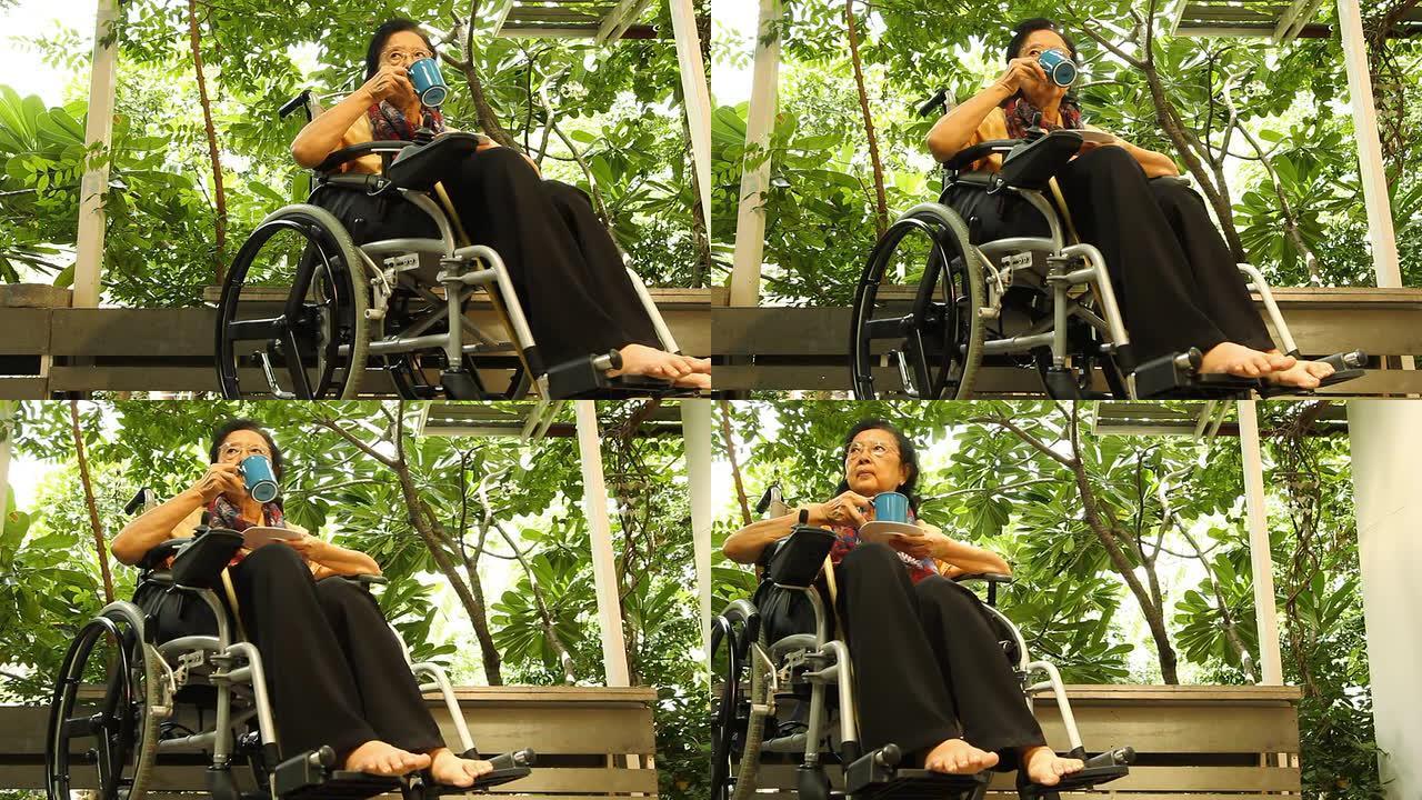坐在轮椅上的亚洲成年妇女
