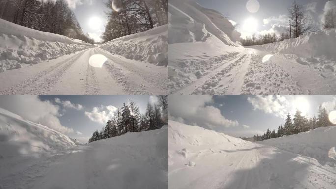 雪地冬季公路行驶至太阳