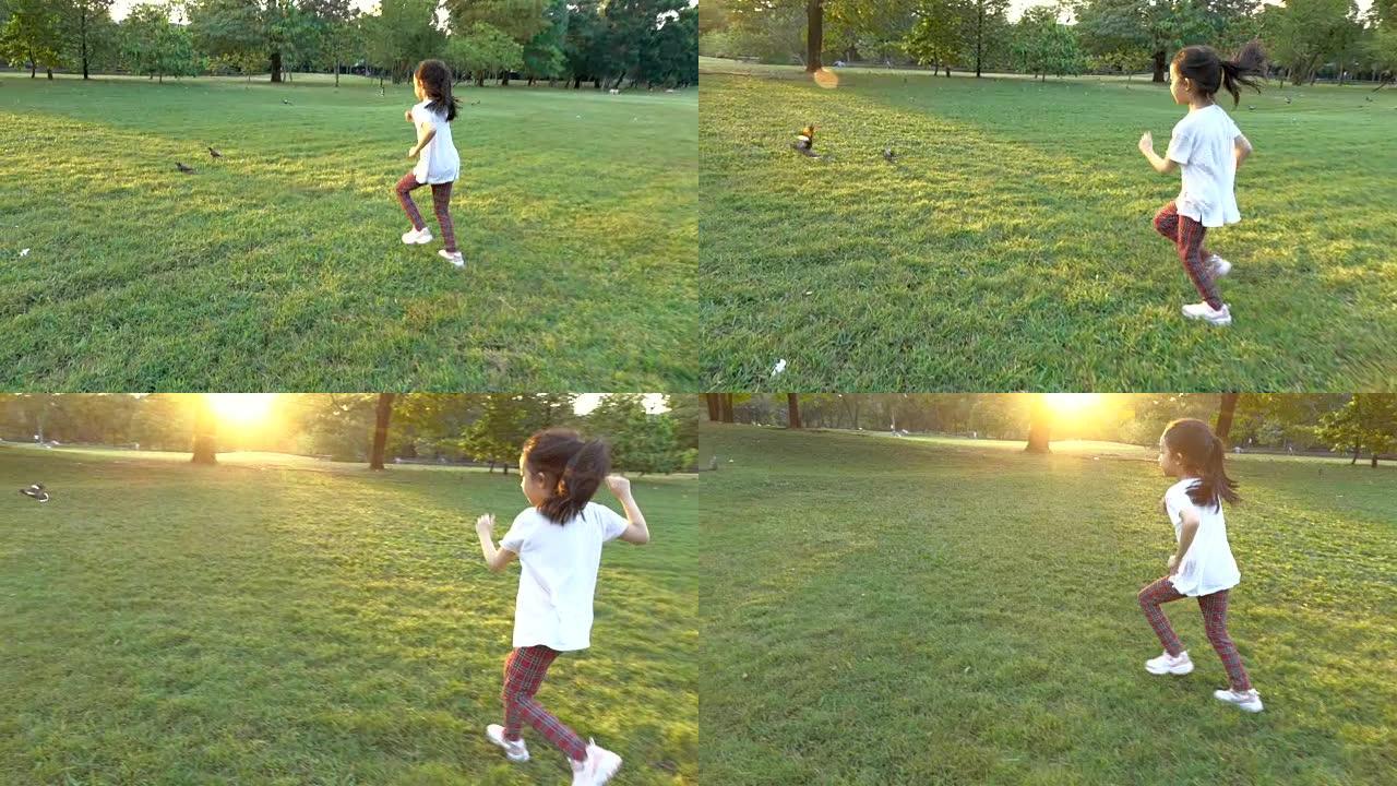幸福亚洲小女孩跑公园抓鸟