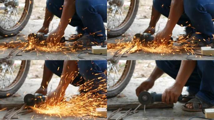 用研磨机切割金属的工人