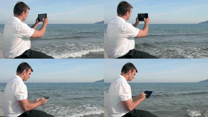 男子用平板电脑拍摄图像
