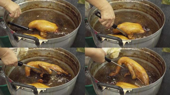 煮沸的鸭子厨师卤煮卤制传统食物街边小摊