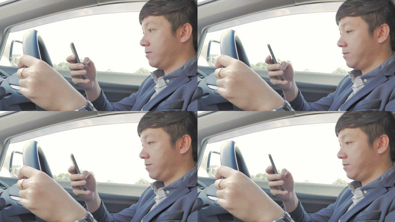商人在汽车中使用智能手机，特写镜头