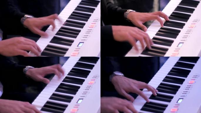 特写两只手在钢琴上弹奏