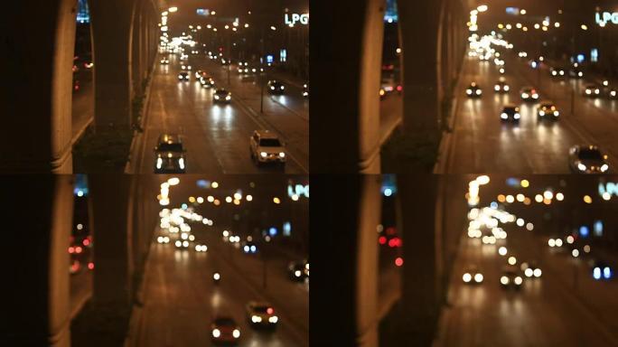 夜间城市交通。汽车前灯和尾灯不聚焦