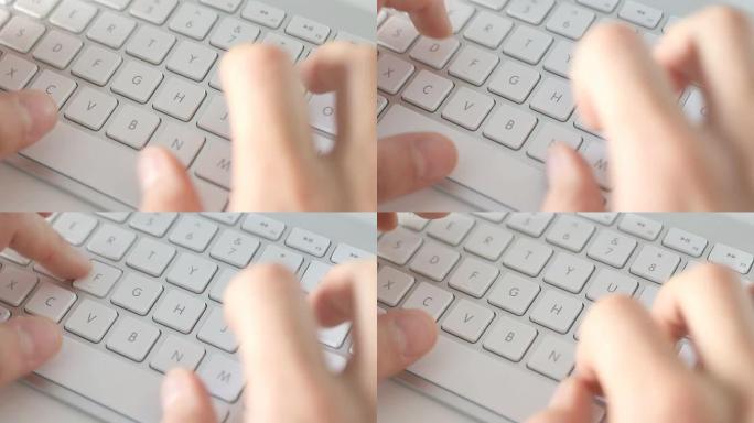 男性手在电脑键盘上打字
