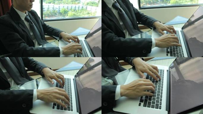 高清: 商人正在使用笔记本电脑