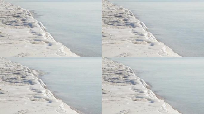 海岸线共享被雪和海浪覆盖的土地