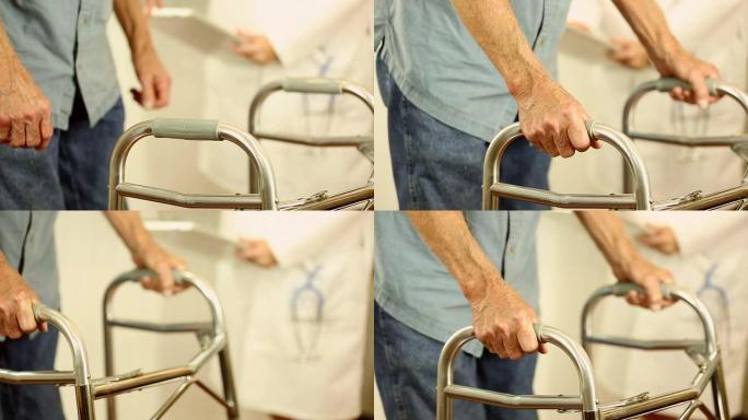 女医生帮助老年男性患者使用助行器。握着手。
