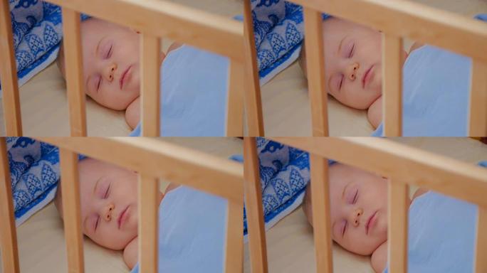 睡在婴儿床里的小婴儿，特写
