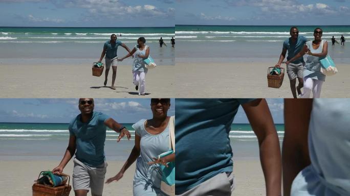一对非洲夫妇在海滩上奔跑