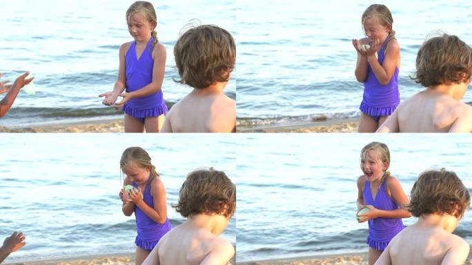 慢镜头女孩在海滩上抓水球