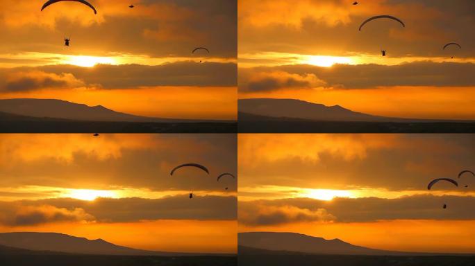 日落时的滑翔伞轮廓