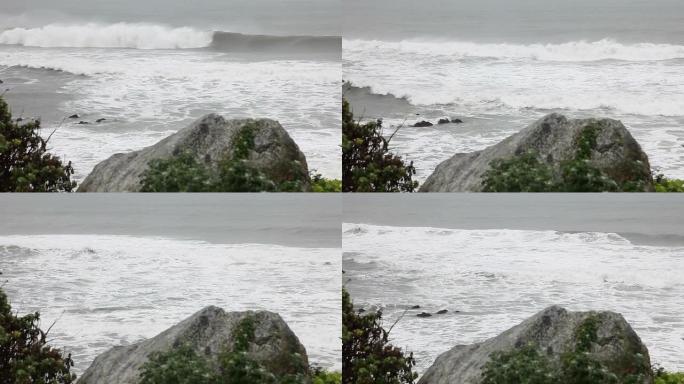 巨大的灰色波浪大海边浪花海岛拍打石头礁石