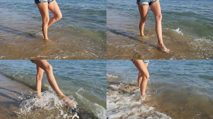 顽皮女人的腿泼水女人的腿泼水海边散步