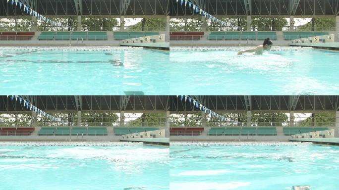 游泳运动员练习蝶泳