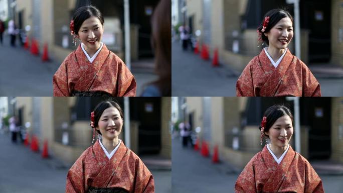 穿着和服的日本女孩在涩谷与她的朋友交谈