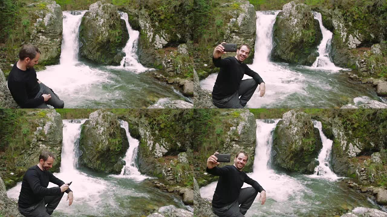 快乐男人在瀑布边拍照