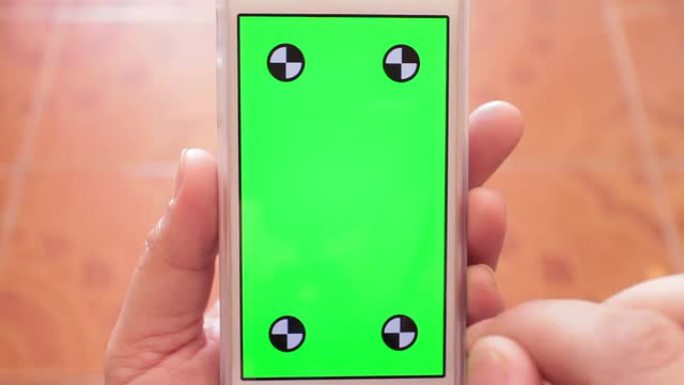 人类手用智能手机，绿色屏幕