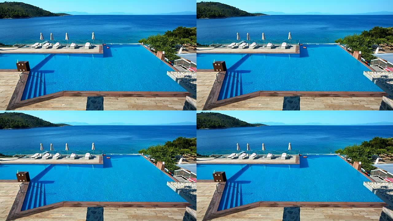 斯科普洛斯岛游泳池的躺椅和雨伞