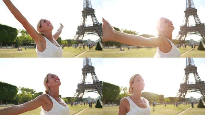 埃菲尔铁塔上的欢呼女人-巴黎伸出双臂