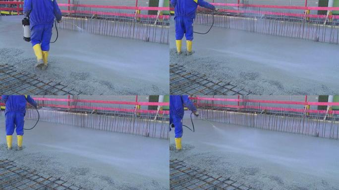 工人清洗混凝土地板