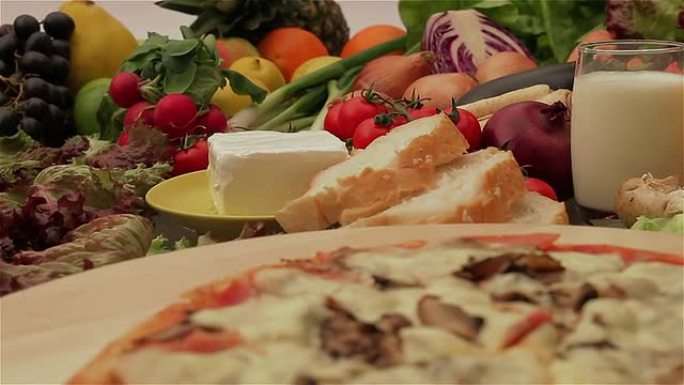 Pizza with fresh vegetables and fruits
