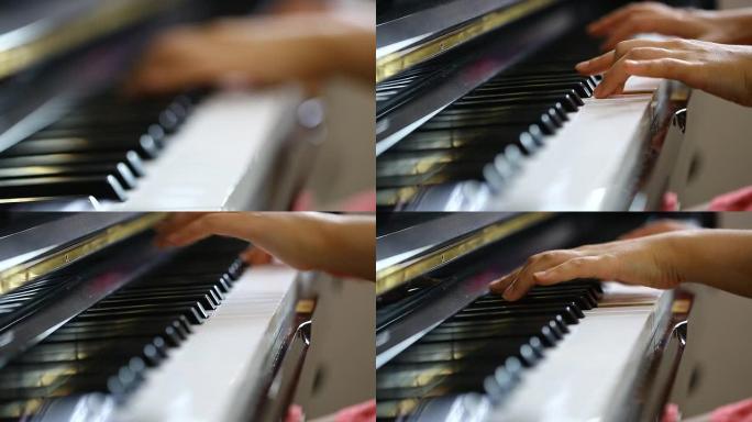 一个年轻女子弹钢琴的手