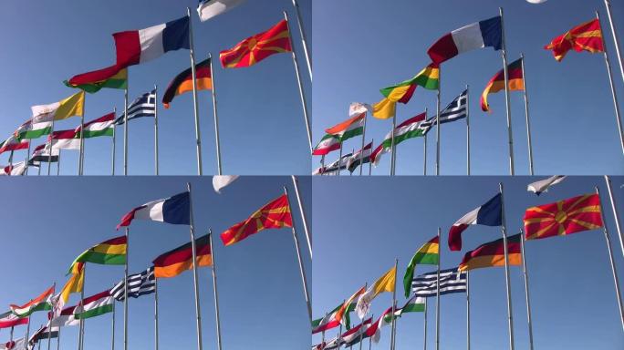 来自法国、德国、希腊等国家的国旗。蓝色的天空。