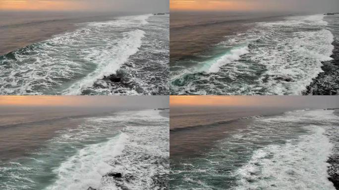 印度尼西亚巴厘岛日落海滩的蓝浪