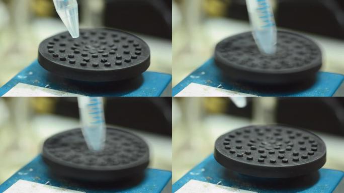 用自动机器搅拌塑料离心管。