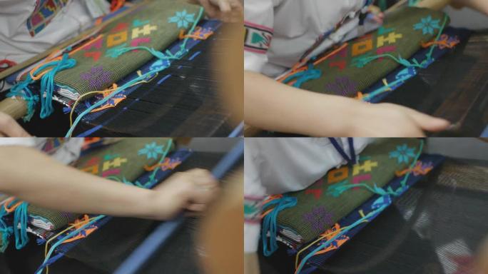 亚洲女性传统手工编织面料，彩色图案，特写