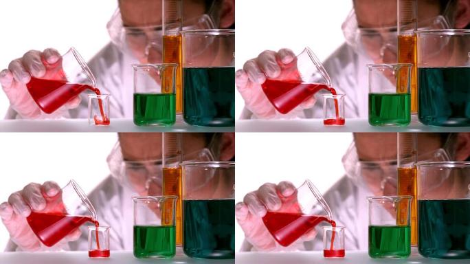 科学家将红色液体倒入烧杯中