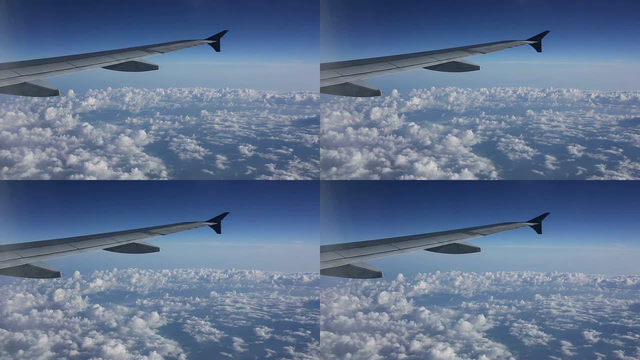 从飞机窗外俯瞰云层和一些湍流