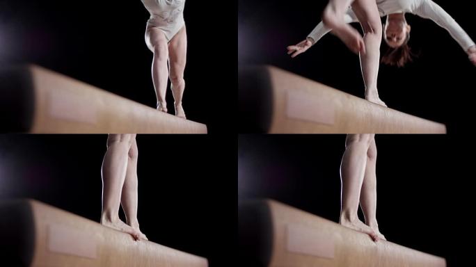 一名女子体操运动员做平衡木翻转的SLO MO脚