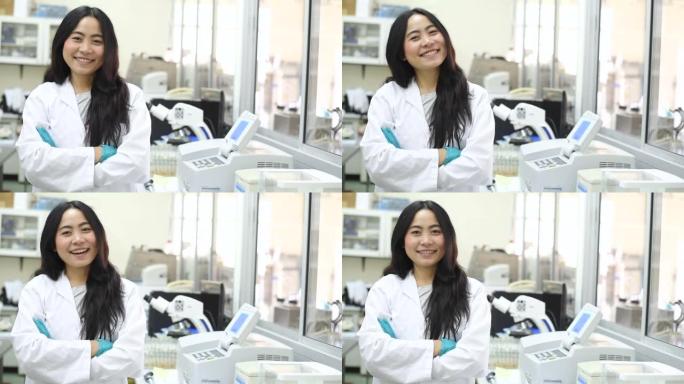 年轻的亚洲女科学家在实验室微笑