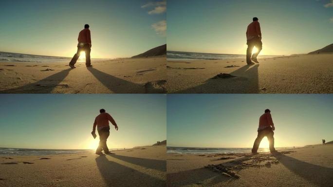 WS TS男子沿着马里布海滩散步