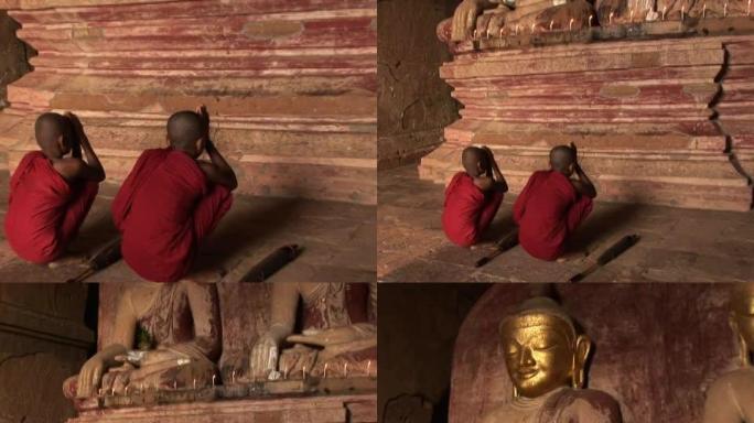 两个带着佛祖PAL163祈祷的新手僧侣