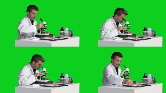 男性科学家用显微镜观察并做笔记