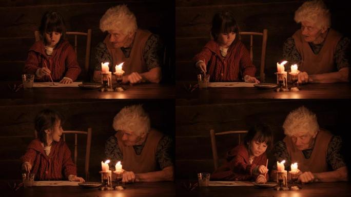 一个年轻的女孩在烛光下与祖母一起绘画