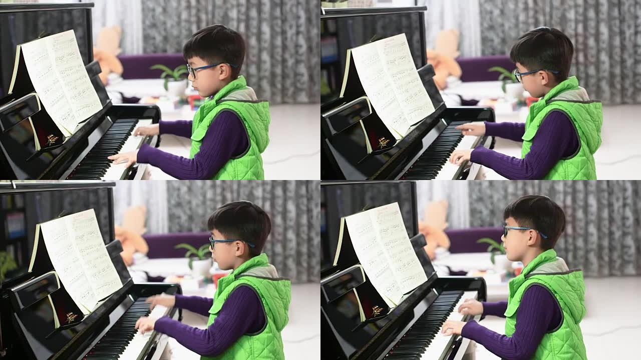男孩弹钢琴男孩弹钢琴