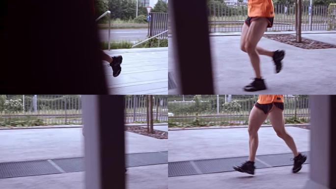 SLO MO TS男性腿在城市街道上奔跑