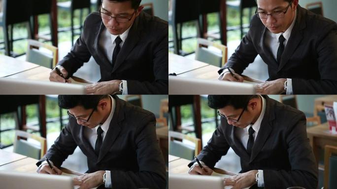 高清视频-商务人员在办公室使用笔记本电脑。